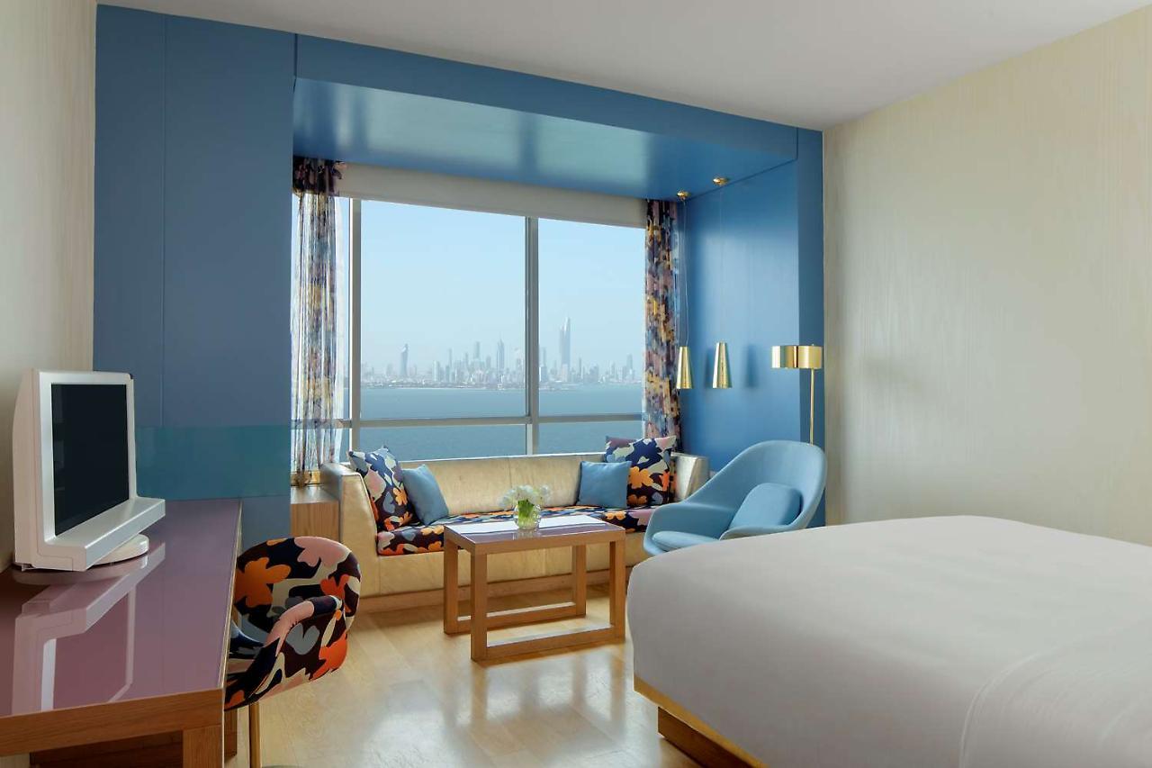 Symphony Style Hotel Kuwait Salmiya Kültér fotó A room at the hotel