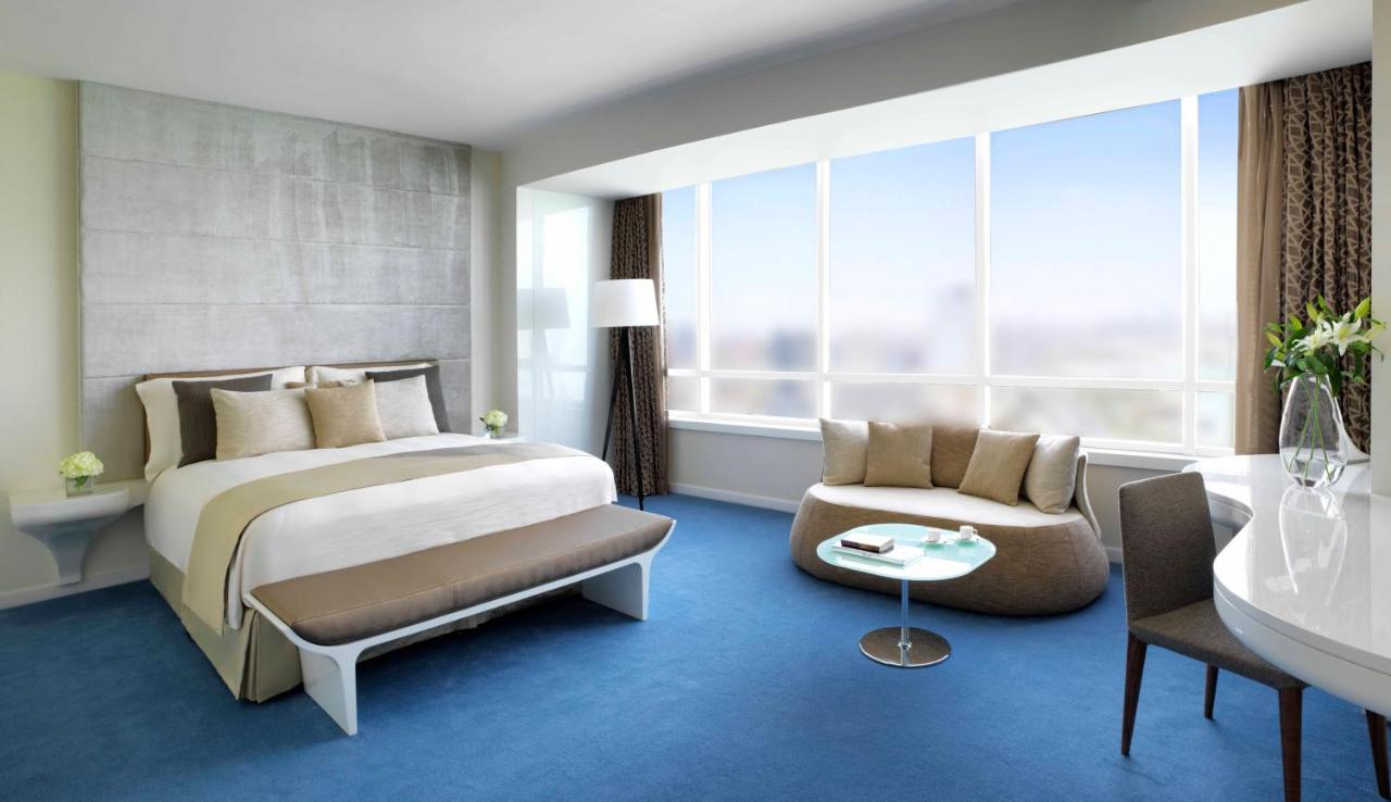 Symphony Style Hotel Kuwait Salmiya Kültér fotó A bedroom at the hotel