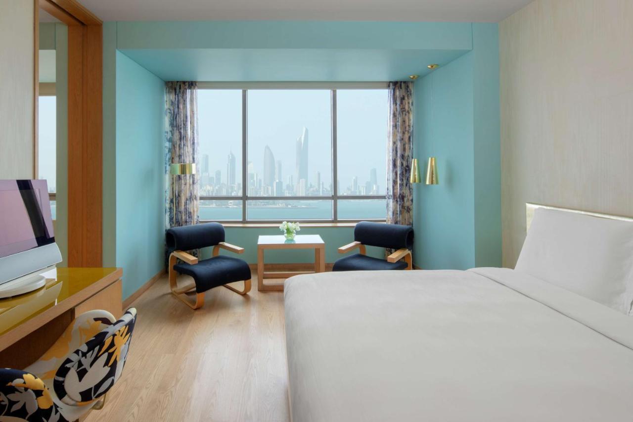 Symphony Style Hotel Kuwait Salmiya Kültér fotó A room at the hotel